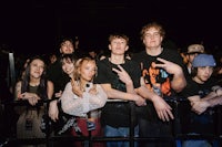 a group of people posing for a picture at a concert