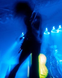 a blurry image of a person on a stage