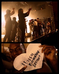 a man is holding up a sign that says happy birthday