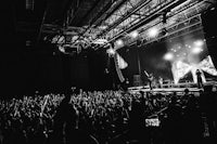 a black and white photo of a crowd at a concert