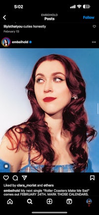 a picture of a woman with long red hair