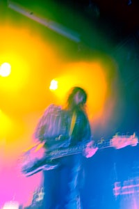 a person playing a guitar on stage